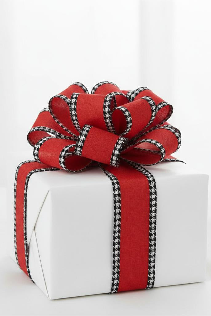 2.5-inch red ribbon with black and white houndstooth edges tied in a bow on a white gift box.