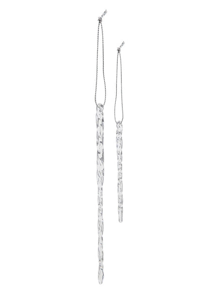 Two clear, twisted glass icicle ornaments with silver hanging strings against a white background.