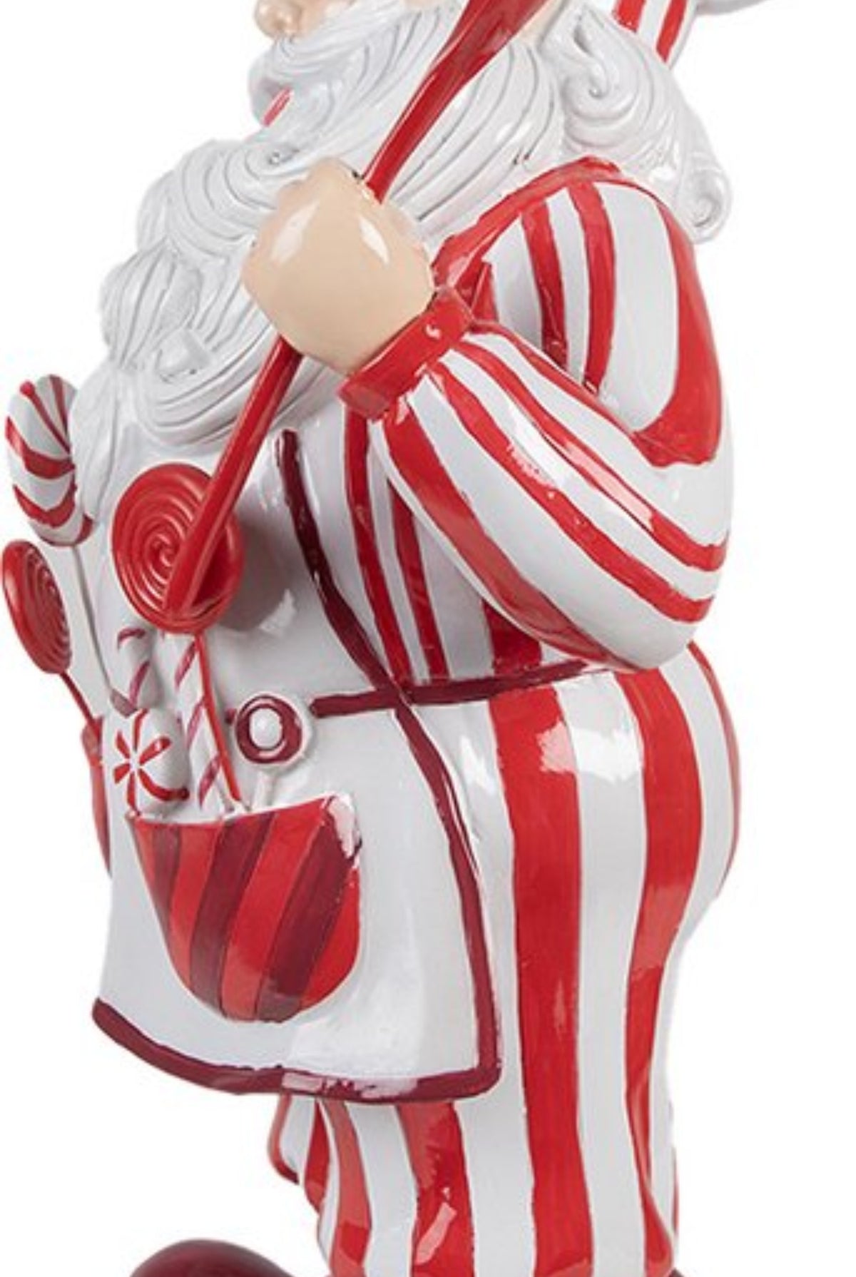 Side view of 19 inch resin Peppermint Chef Santa figurine with red spoon and candy apron