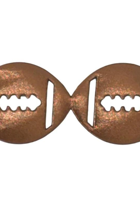 Close-up of copper metallic vinyl football streamer texture