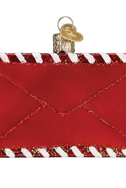 Red glass envelope ornament with glittery white and red candy cane striped borders and a gold heart charm topper.