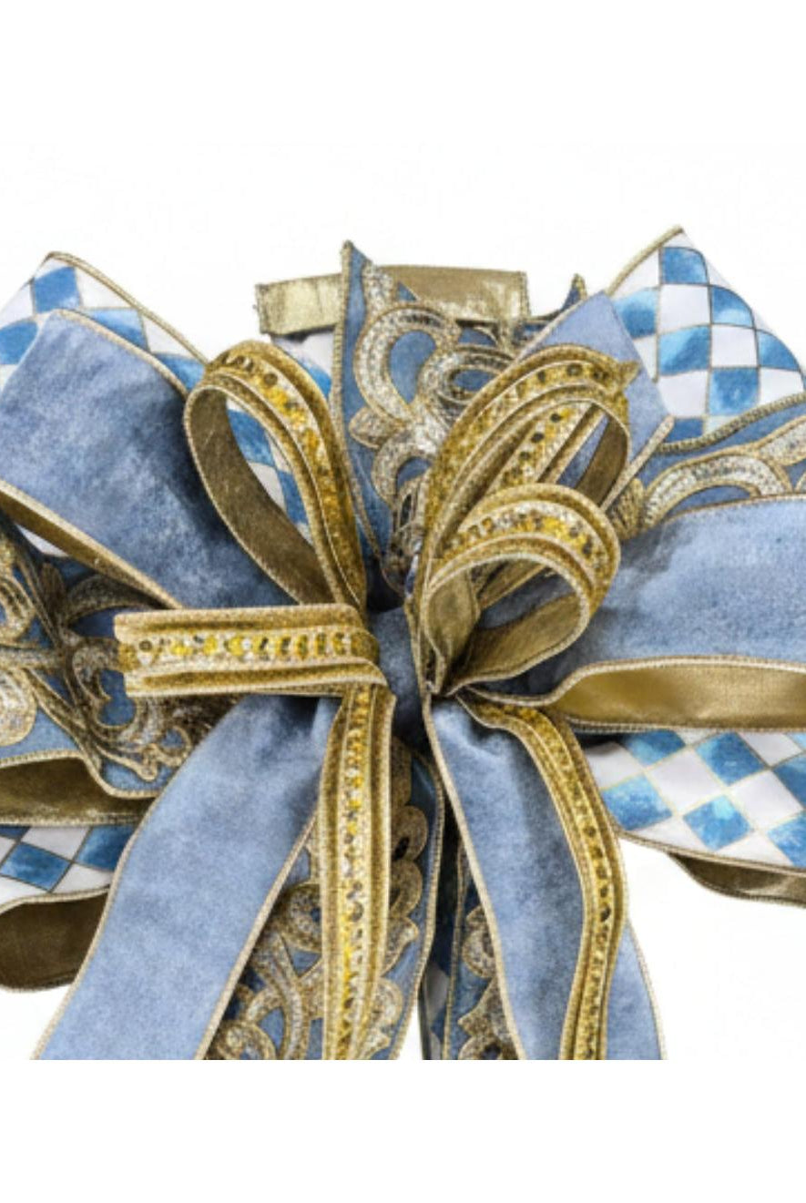 Large blue and gold harlequin bow featuring velvet ribbon, intricate gold scrollwork, and elegant jewel accents.