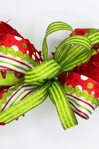 Lime green and red polka dot wired Christmas bow with glitter accents