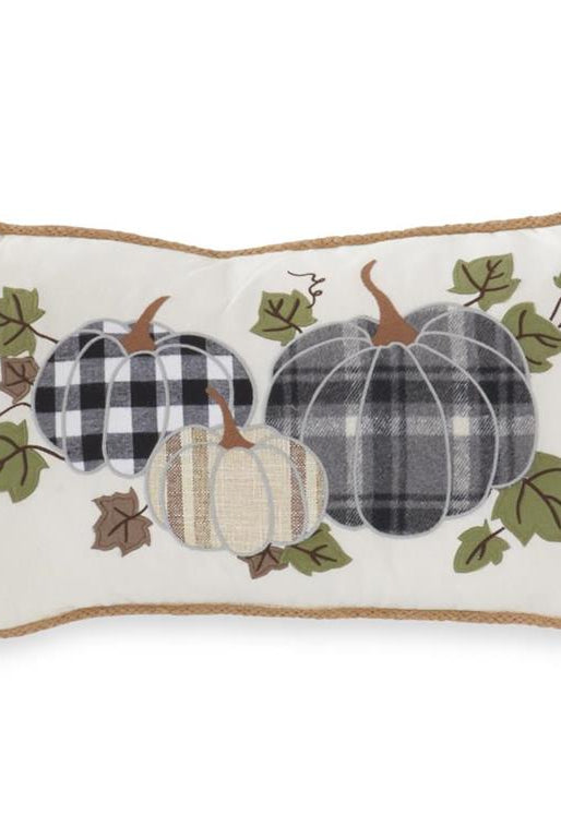 20-inch rectangular cream canvas pillow featuring plaid pumpkin appliqués and natural jute trim for fall decor.