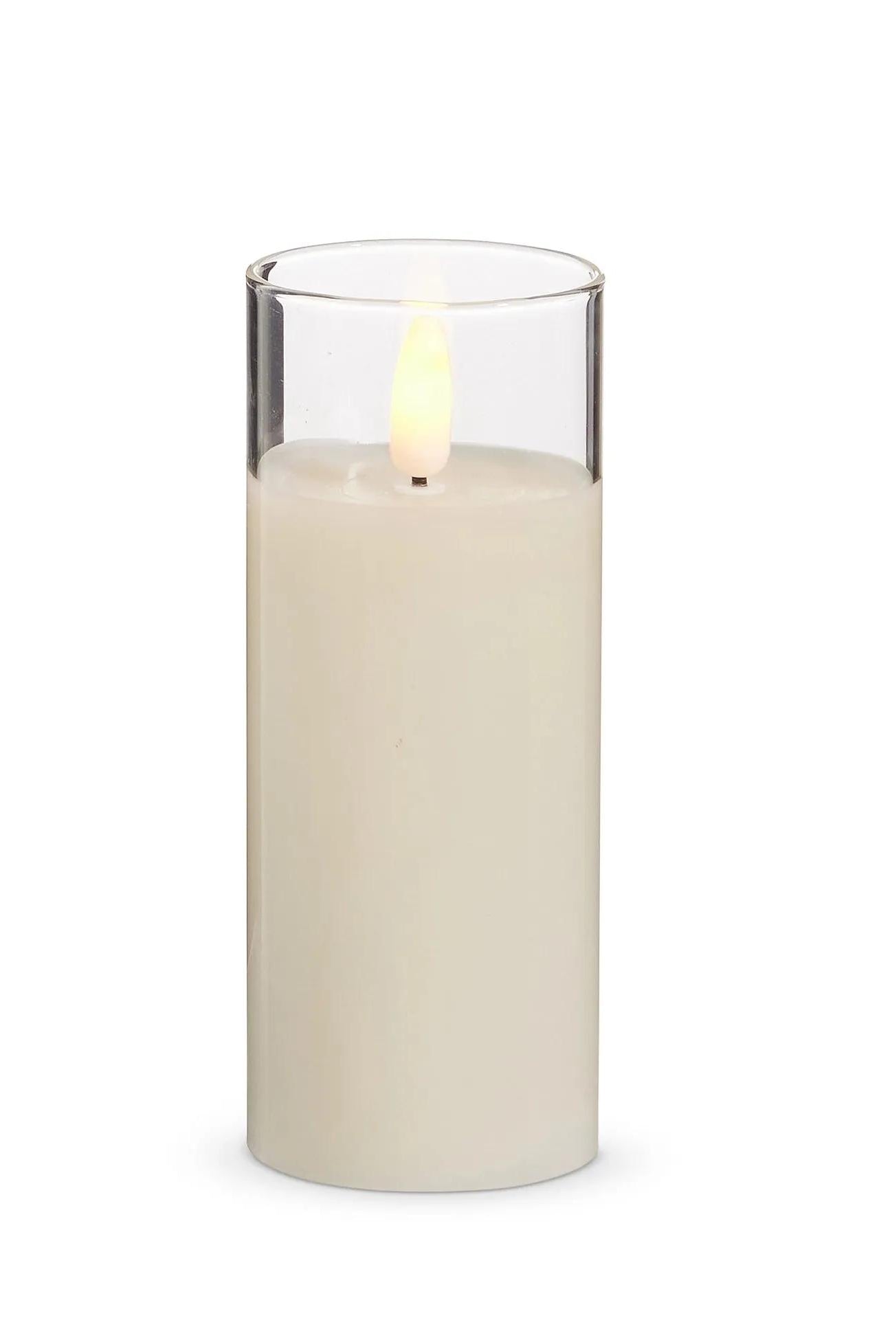 Ivory LED pillar candle in a 5-inch clear glass holder with a realistic flickering flame effect.