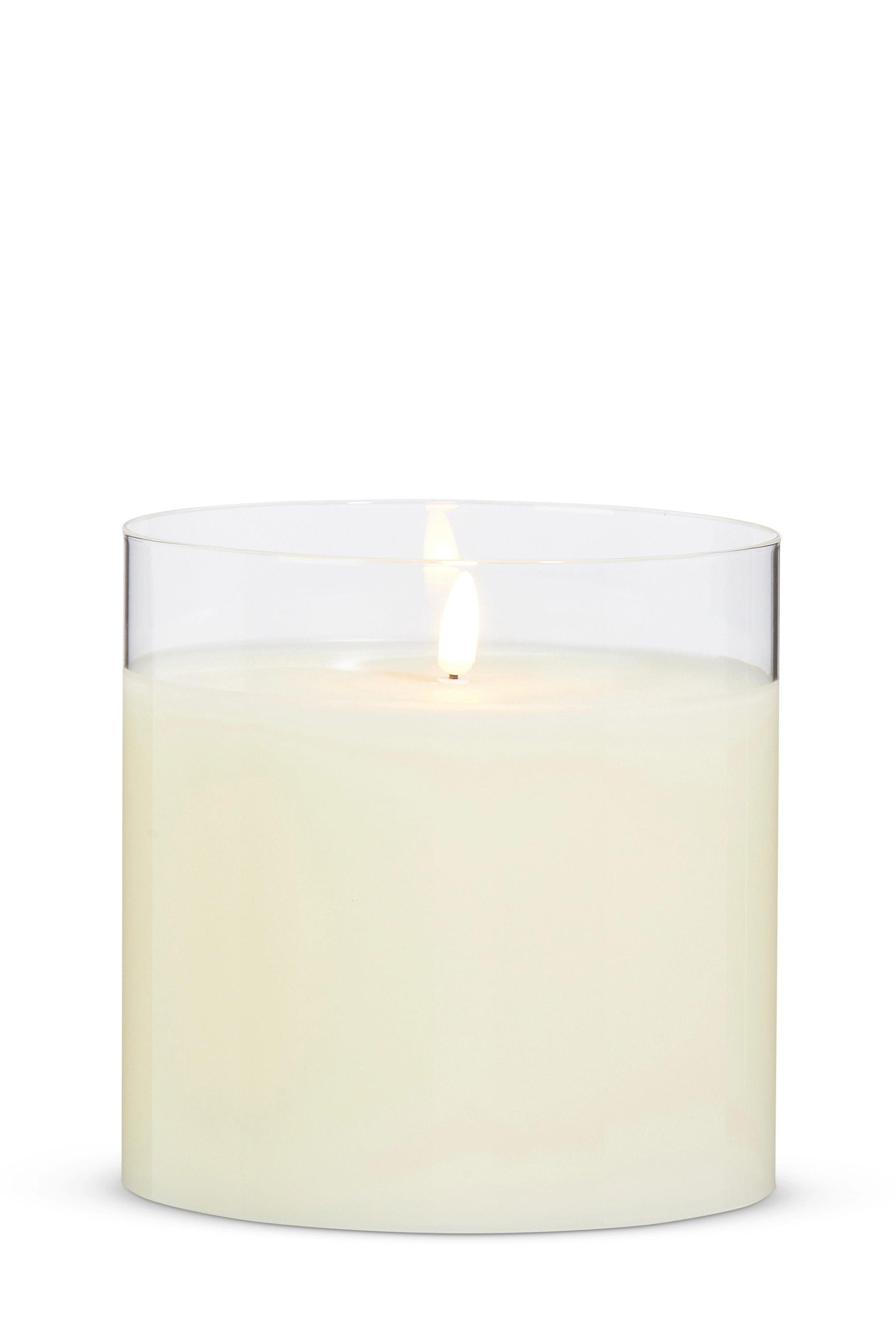 6-inch ivory LED pillar candle with a realistic flickering flame inside a clear glass holder.