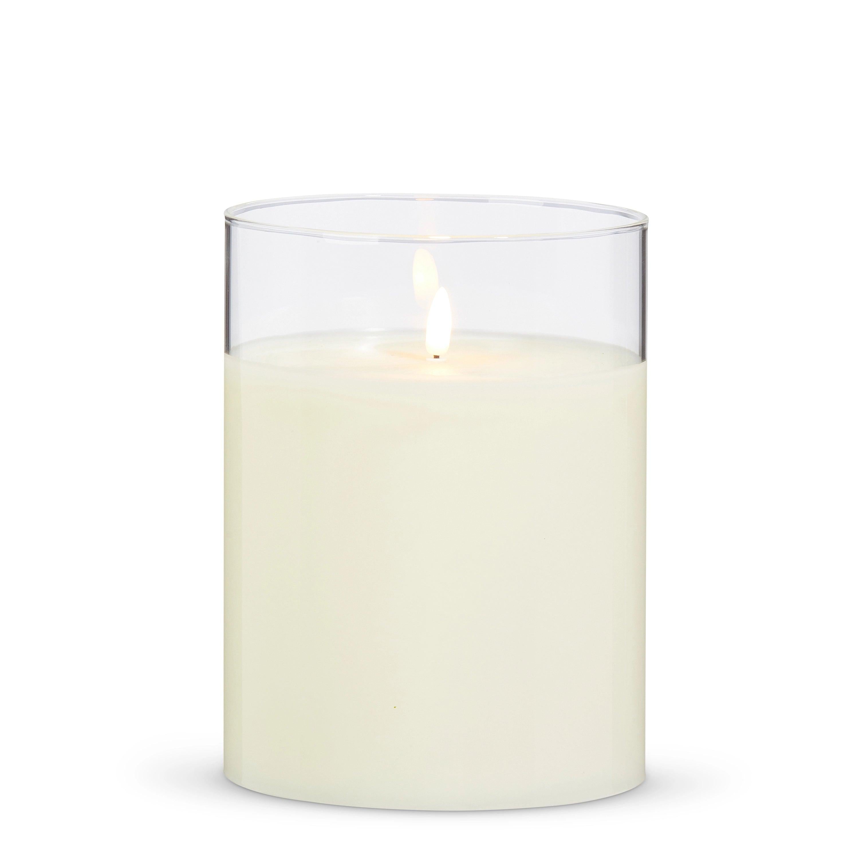 Ivory LED pillar candle in a clear glass holder with a realistic flickering flame, 6 inches wide by 8 inches tall.