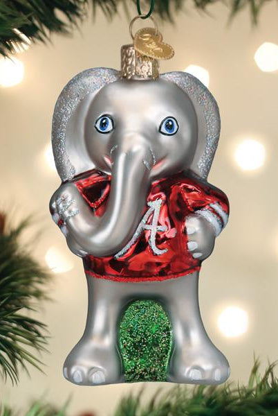Glass Alabama Big Al elephant ornament wearing a shiny red jersey with a white script A logo on a Christmas tree.