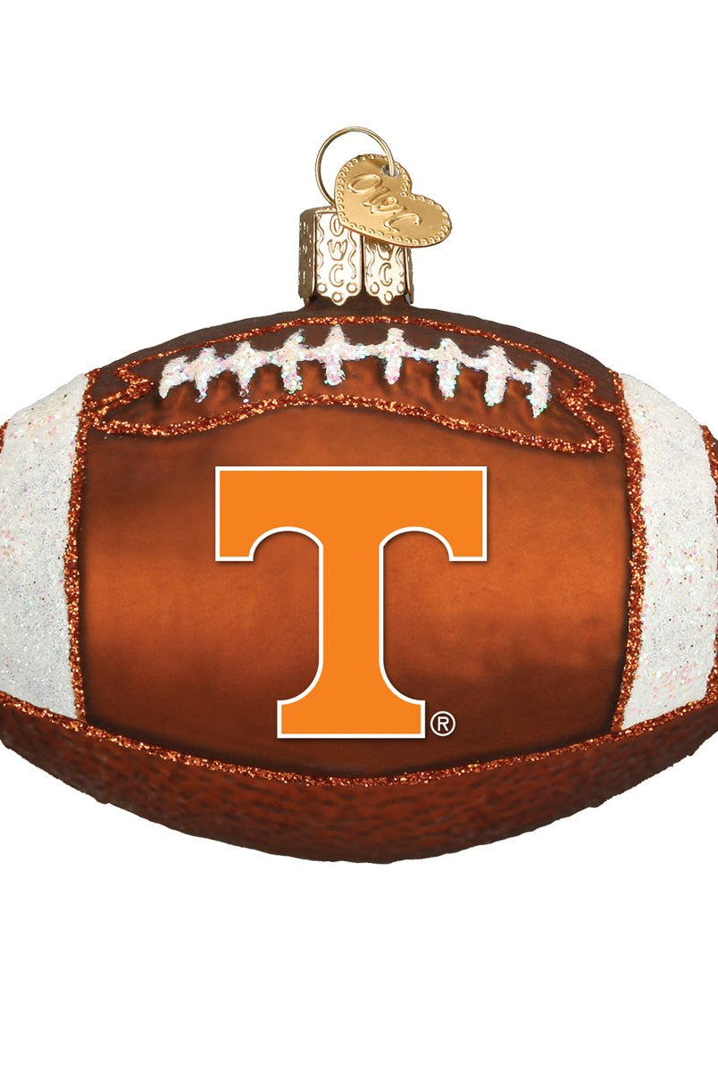 Brown glass football ornament featuring the orange Tennessee Volunteers T logo with white glitter accents.