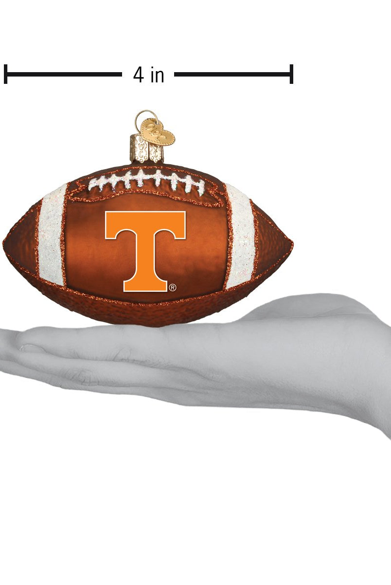 4-inch brown glass football ornament featuring the Tennessee Volunteers orange T logo and glittery white stripes.