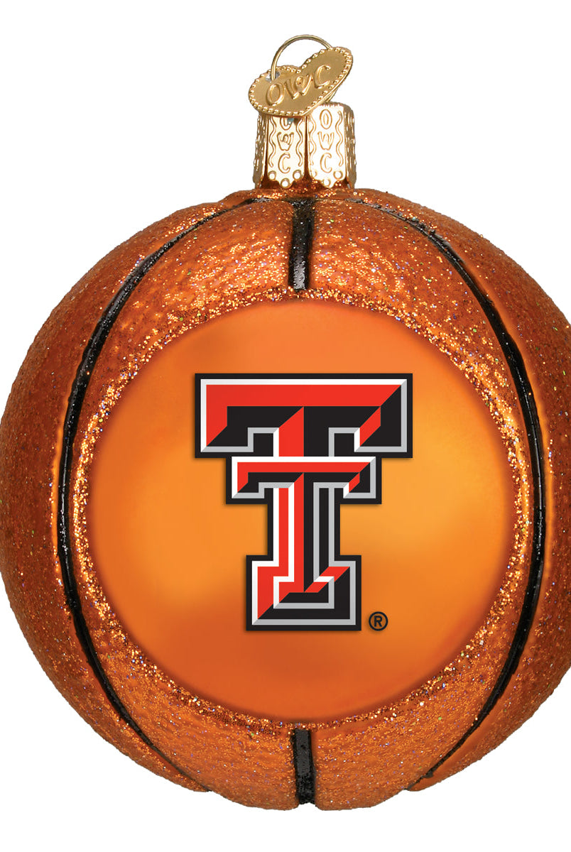 Glittery orange glass basketball ornament featuring the Texas Tech Red Raiders logo on a smooth center panel.