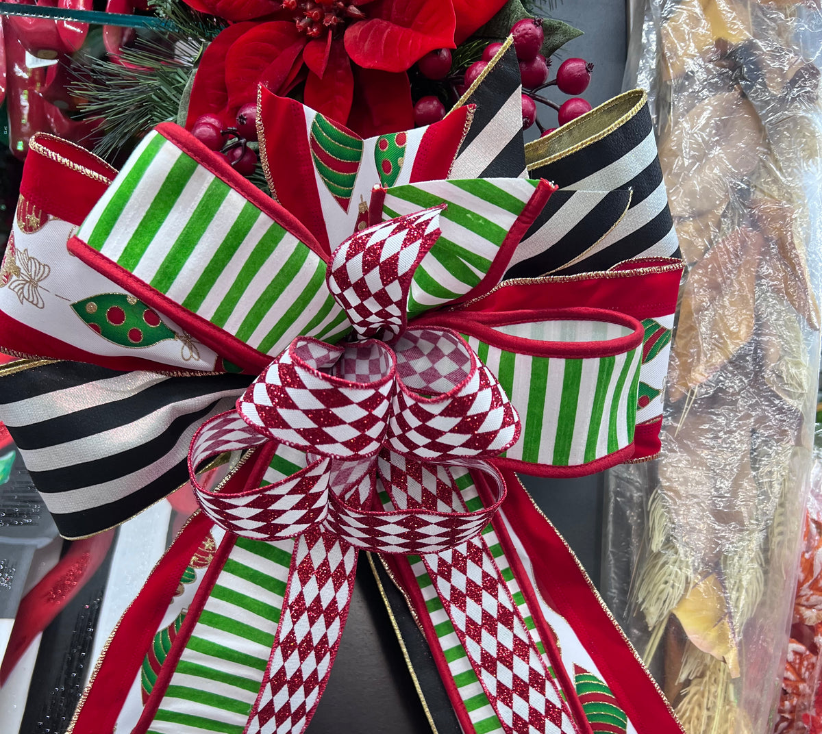 Festive striped Christmas bow attached to holiday wreath