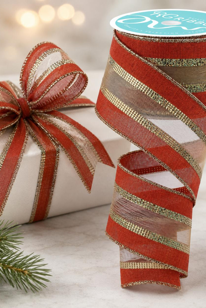 2.5-inch rust and gold wired burlap mesh ribbon roll with a decorative bow on a gift box.