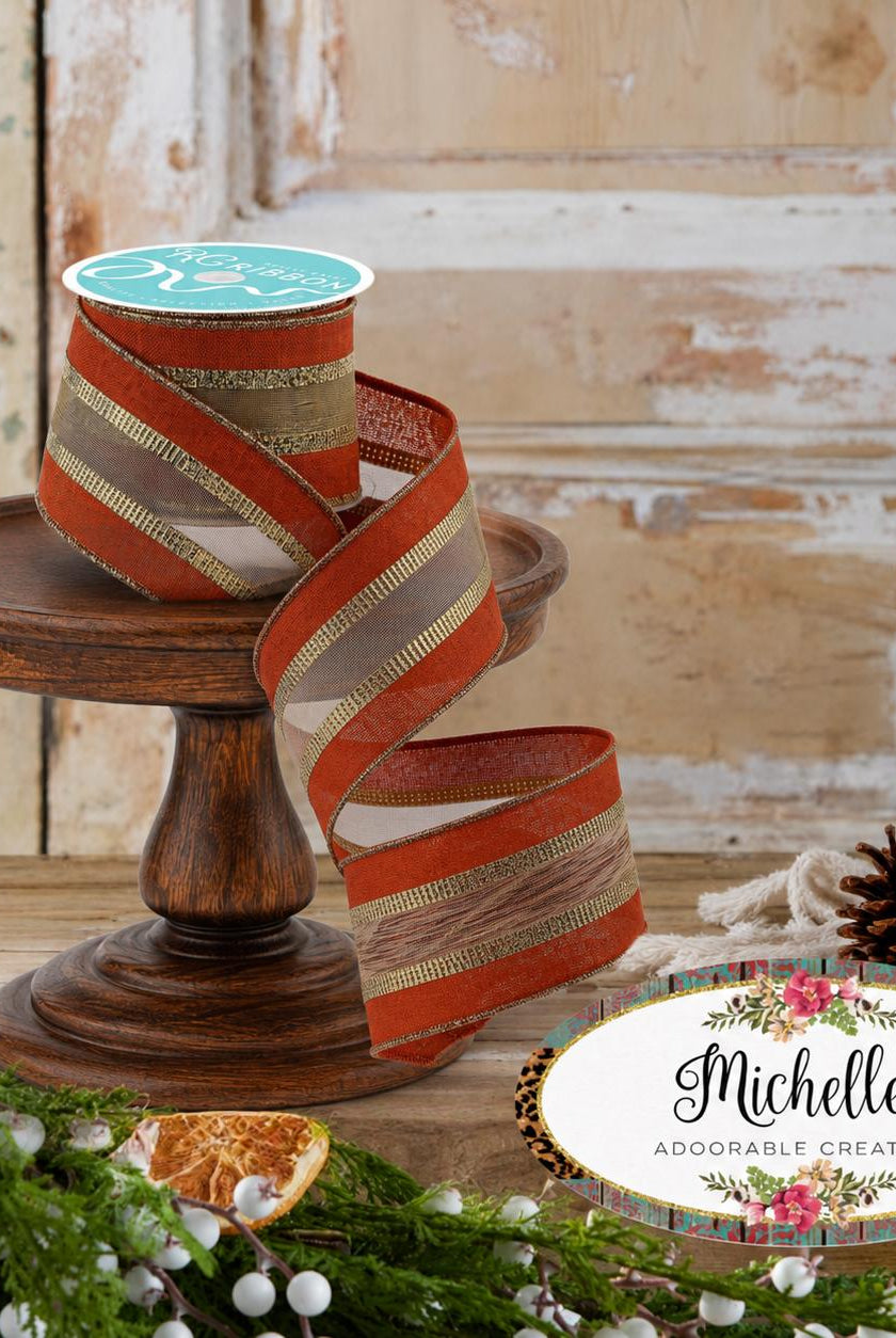 2.5-inch rust and gold wired burlap mesh ribbon on a wooden stand.