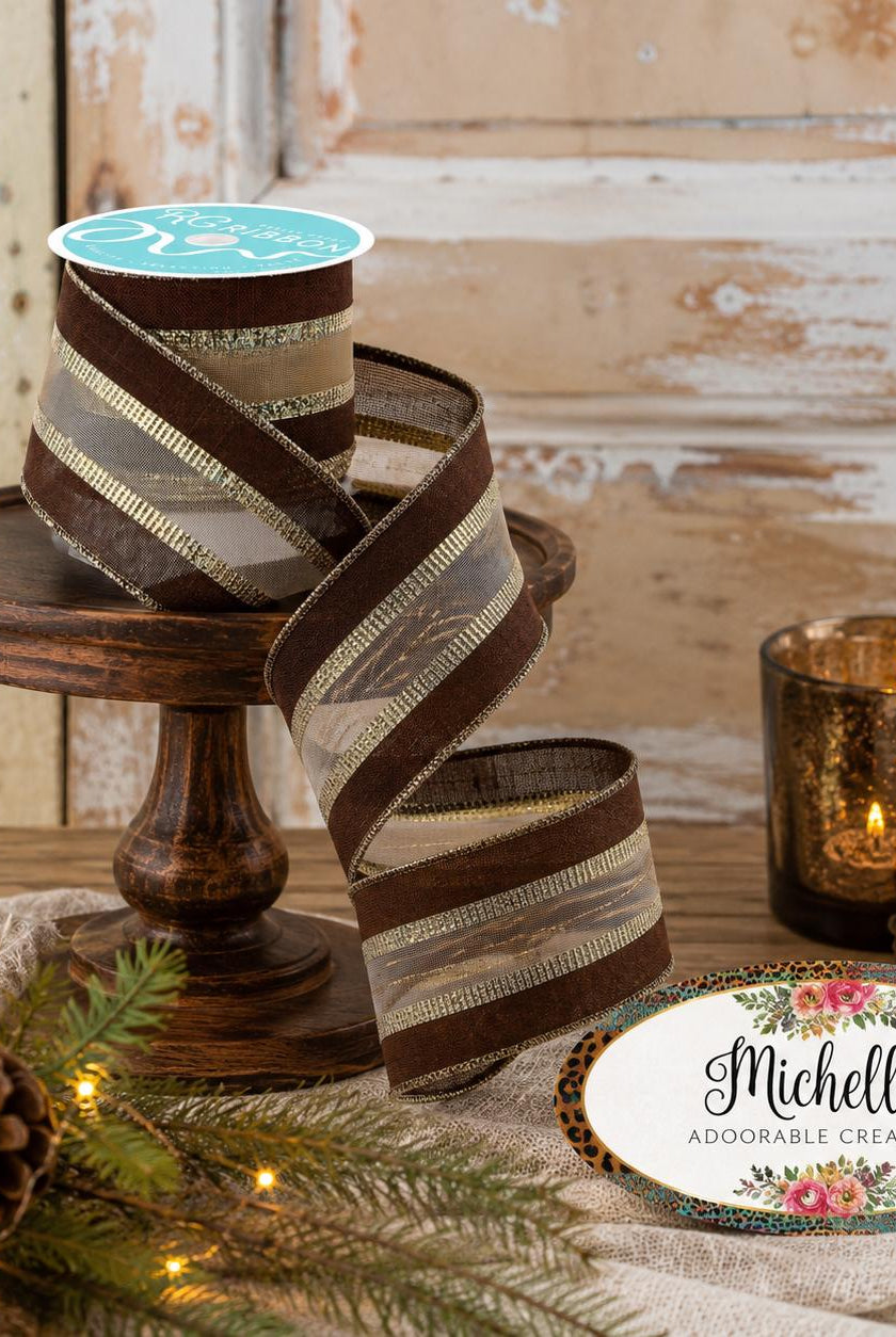 2.5-inch brown and gold royal burlap mesh ribbon with wired edges on a wooden stand.