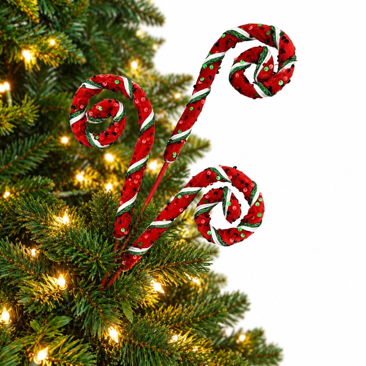 Red sequin curly spray decorating a Christmas tree branch
