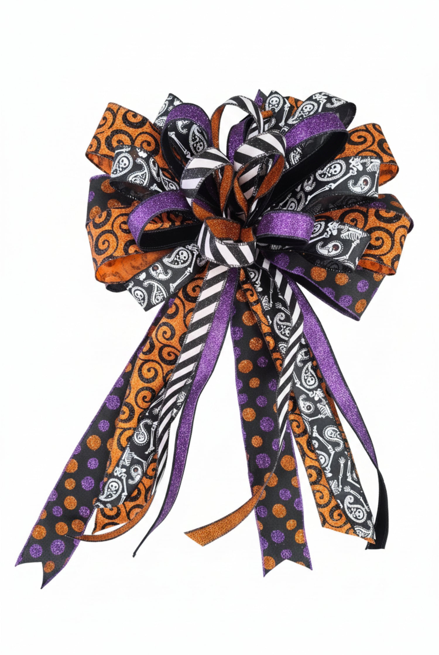 Large Halloween bow featuring orange, purple, and black ribbons with polka dot, stripe, and skull patterns.