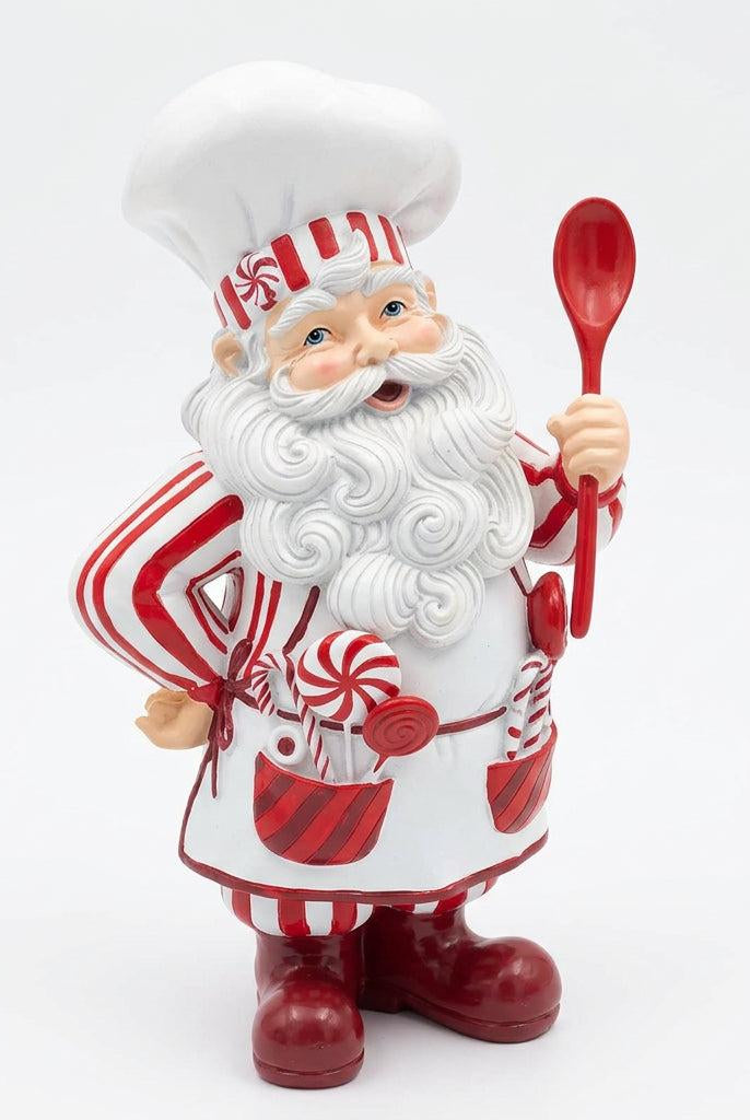 Three-quarter view of striped resin Peppermint Santa chef displaying lollipop-filled apron pockets