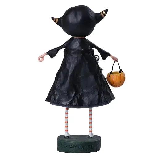 Back view of a 6-inch Veronica Vampire resin figurine wearing a black dress, striped stockings, and holding a pumpkin.