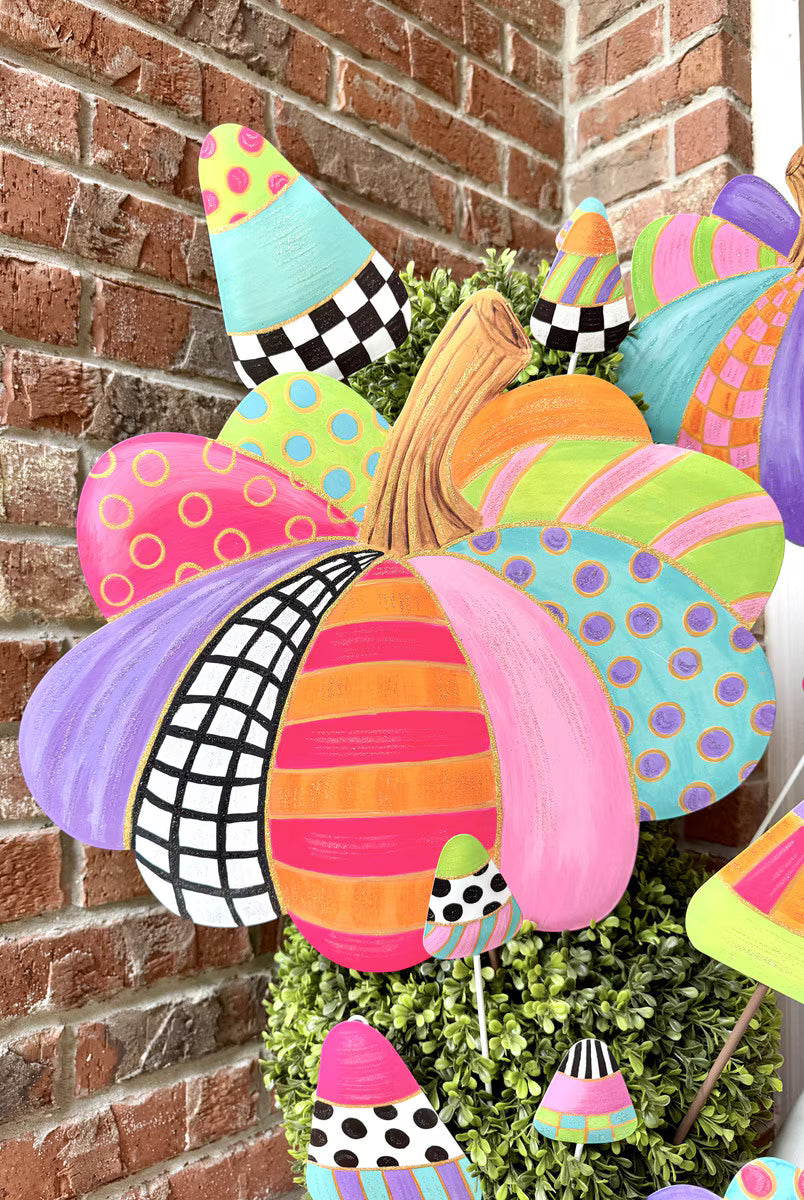 Colorful 19-inch pumpkin garden stake featuring vibrant patterns, polka dots, and stripes in a whimsical, festive autumn style.