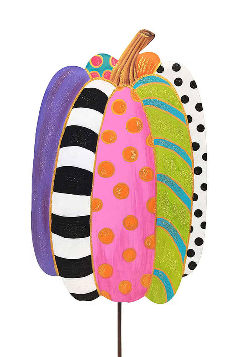 Tall decorative pumpkin garden stake featuring colorful patterned segments in polka dots, stripes, and bright autumn hues.