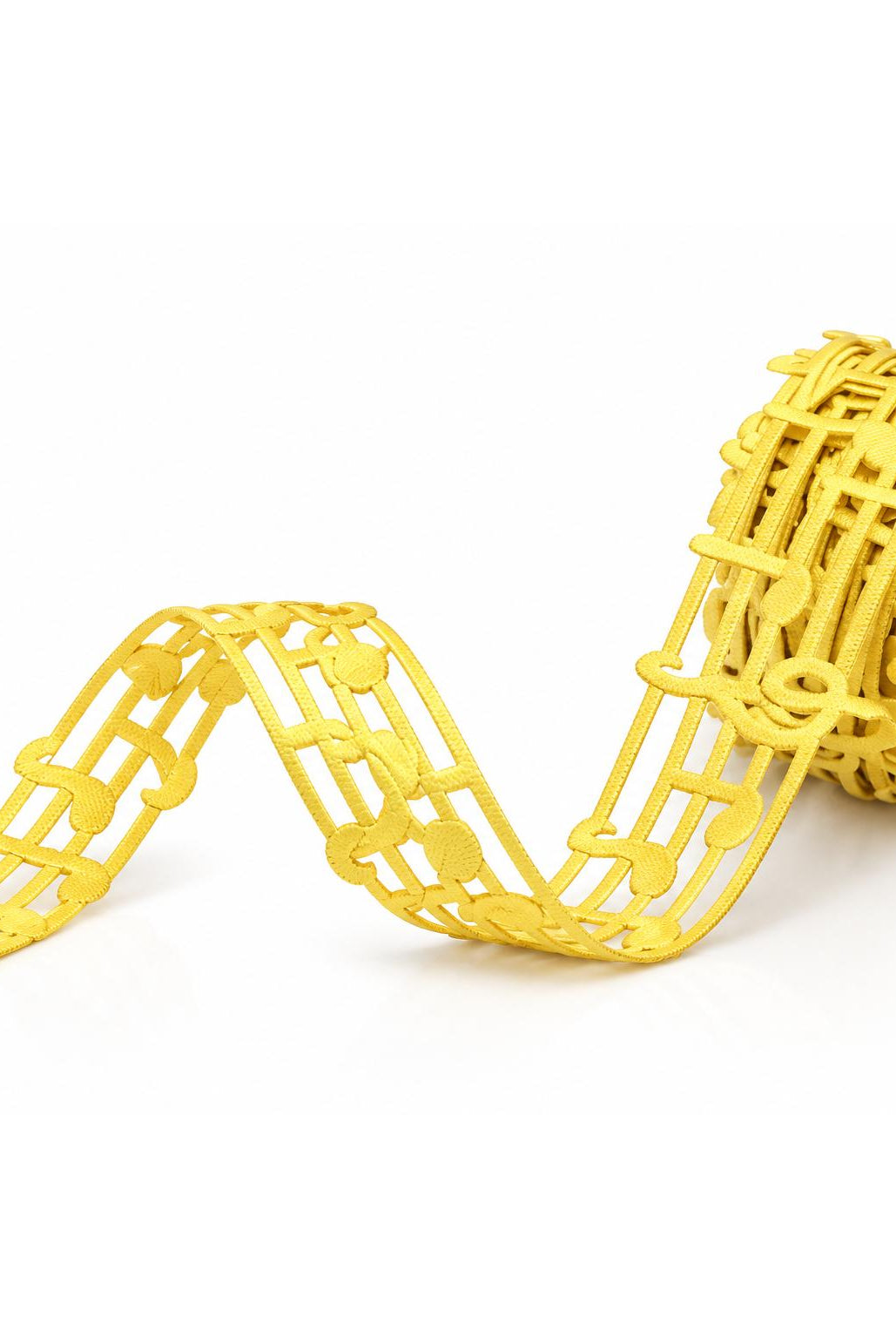 Gold music note lace ribbon unspooling for homecoming gifts