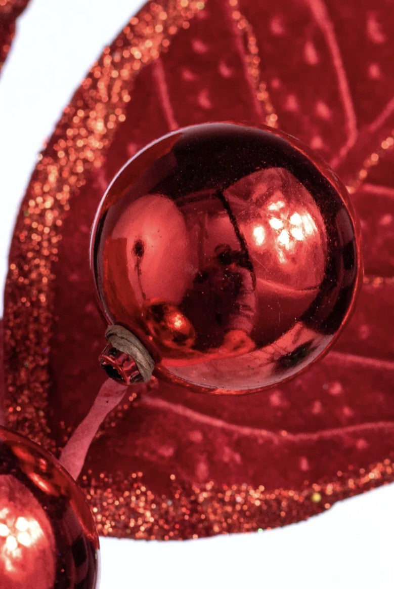 Red velvet holly spray with glitter-edged fabric leaves and two shiny metallic red berries on wired stems.