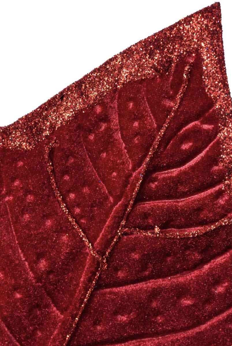 Deep red velvet holly leaf with detailed veins and sparkling glitter edges for Christmas decor.