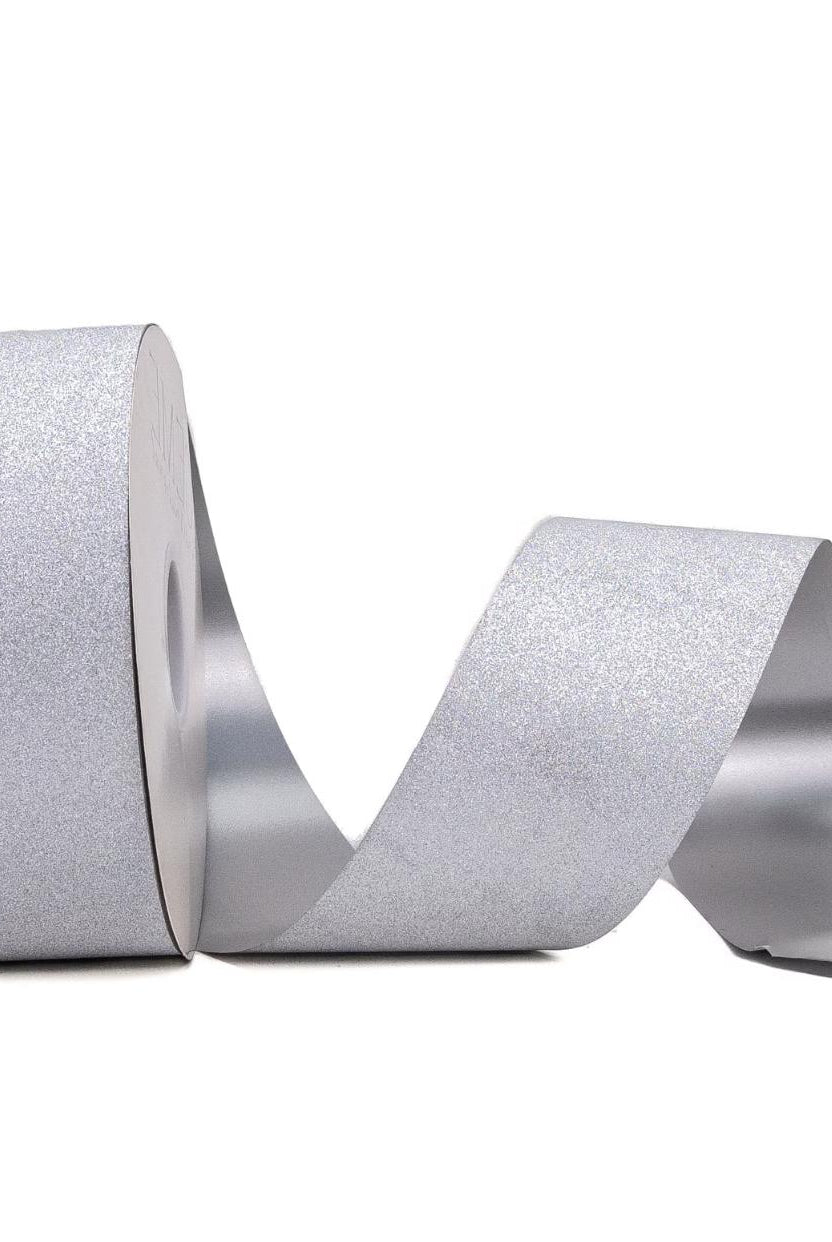 Upright roll of flexible silver glitter homecoming ribbon