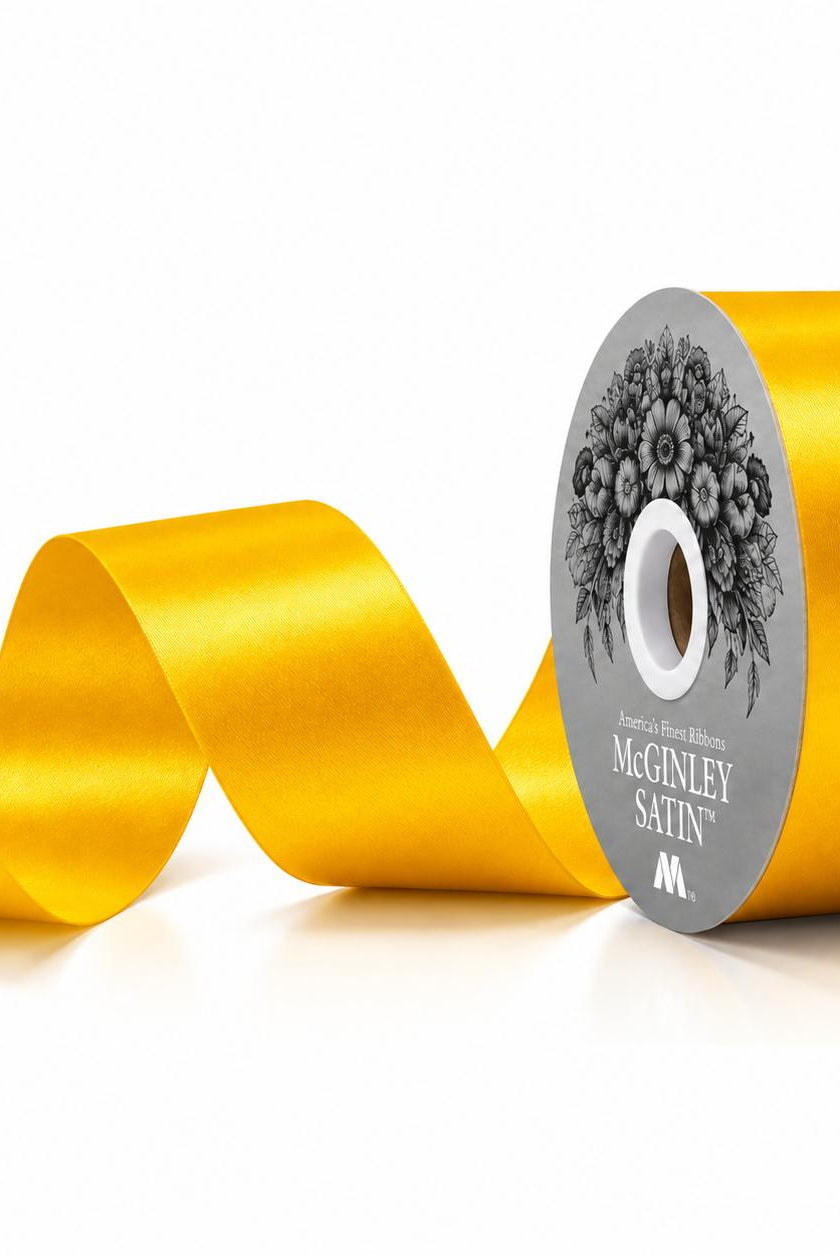 McGinley golden yellow satin ribbon spool with label