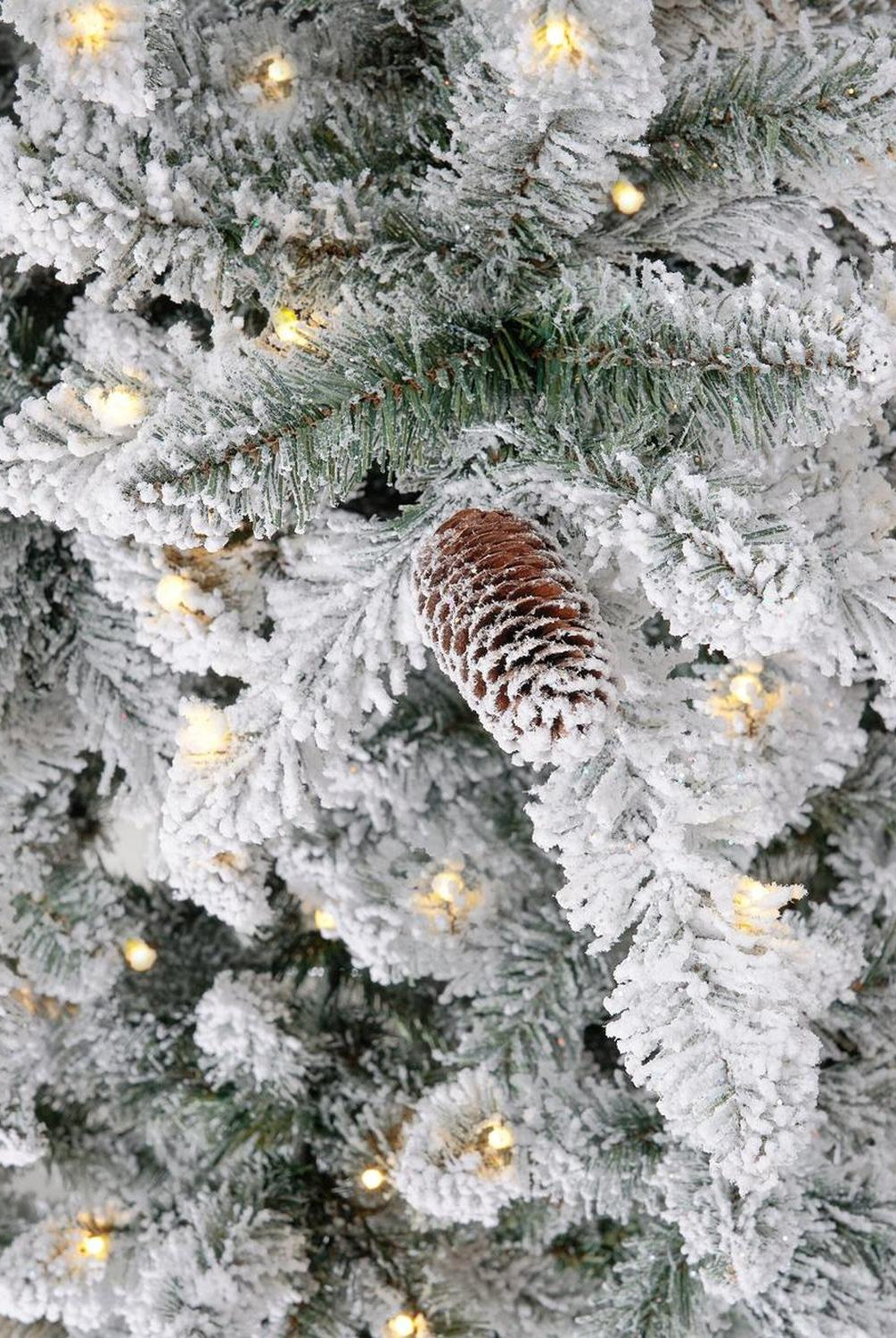 10’ Flocked Livingston Fir Artificial Christmas Tree with Pine Cones, 750 Clear Warm LED Lights and 2424 Bendable Branches