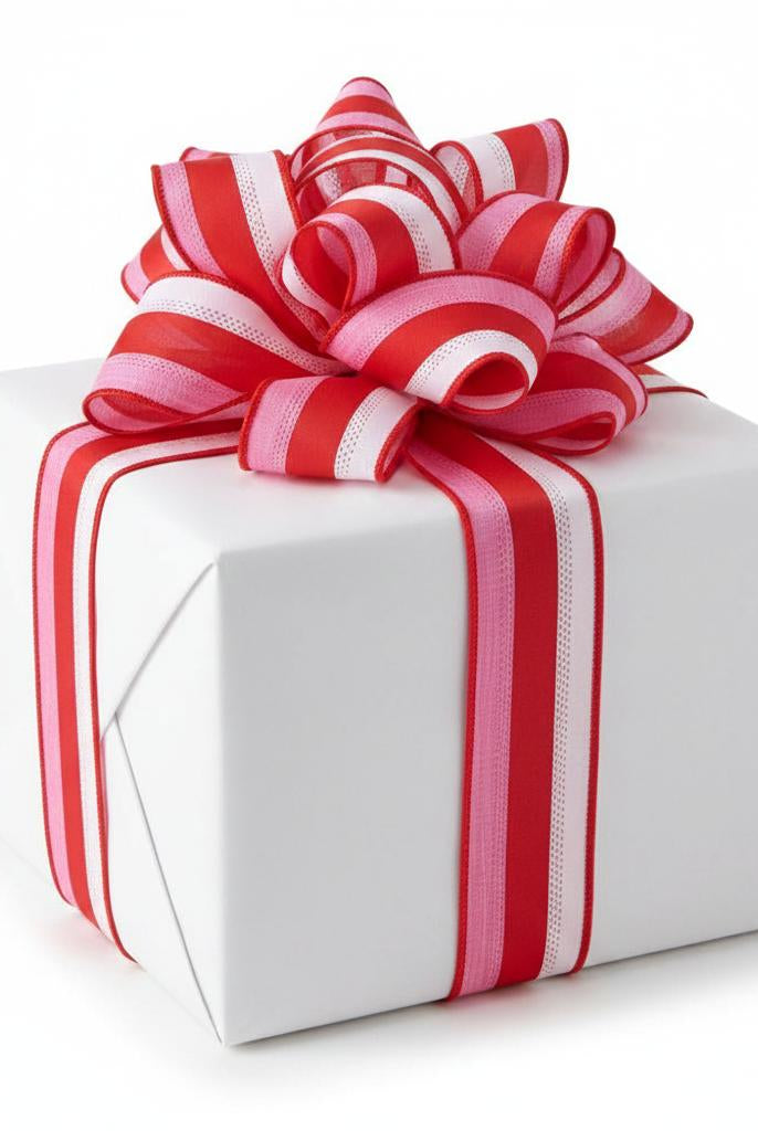 1.5-inch wired tricolor ribbon in red, pink, and white stripes tied in a decorative bow on a white gift box.