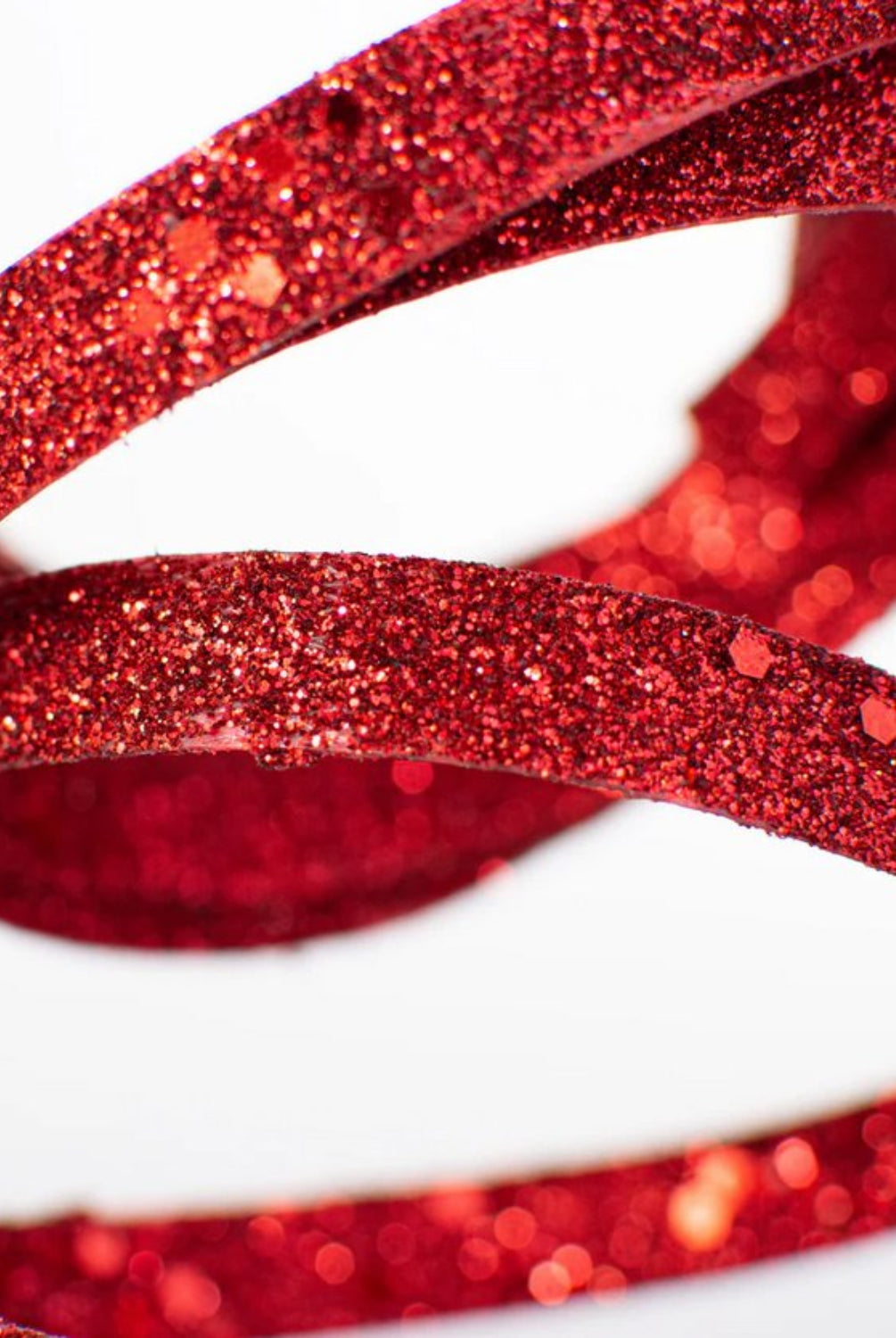 Shop For 25" Glitter Spiral Ribbon Spray: Red