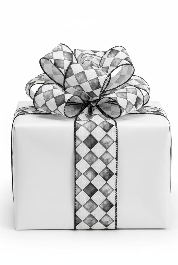 2.5-inch black and white tipsy check canvas ribbon tied in a bow around a white gift box.