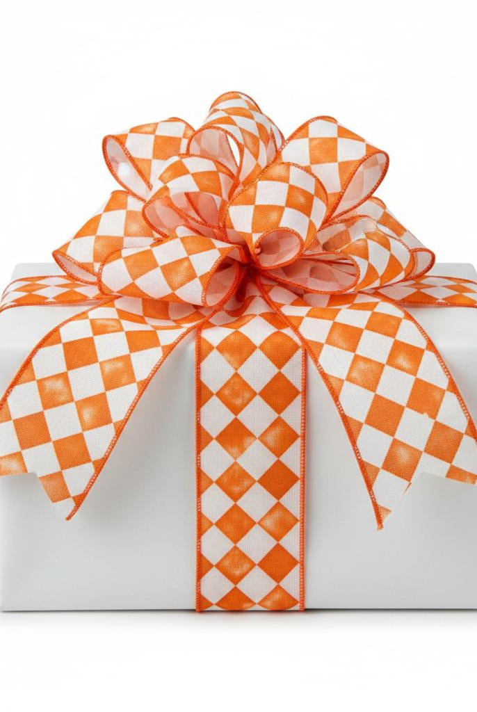 2.5-inch orange and white tipsy check canvas ribbon tied in a decorative bow around a white gift box.
