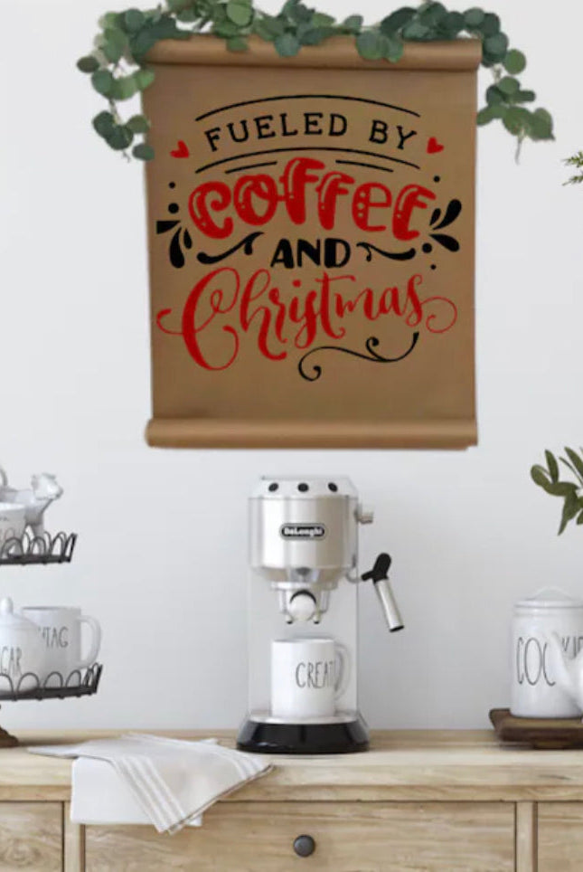 Two mini artificial cedar wreaths with black and white buffalo check ribbons hanging above a coffee station.