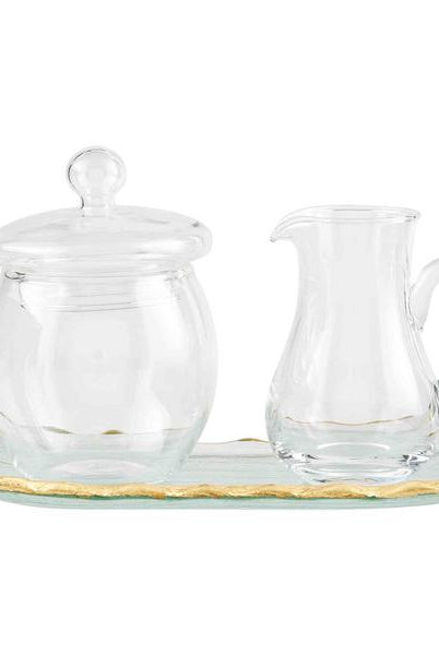 Clear glass cream and sugar set on a matching tray, featuring elegant hand-painted gold edges.