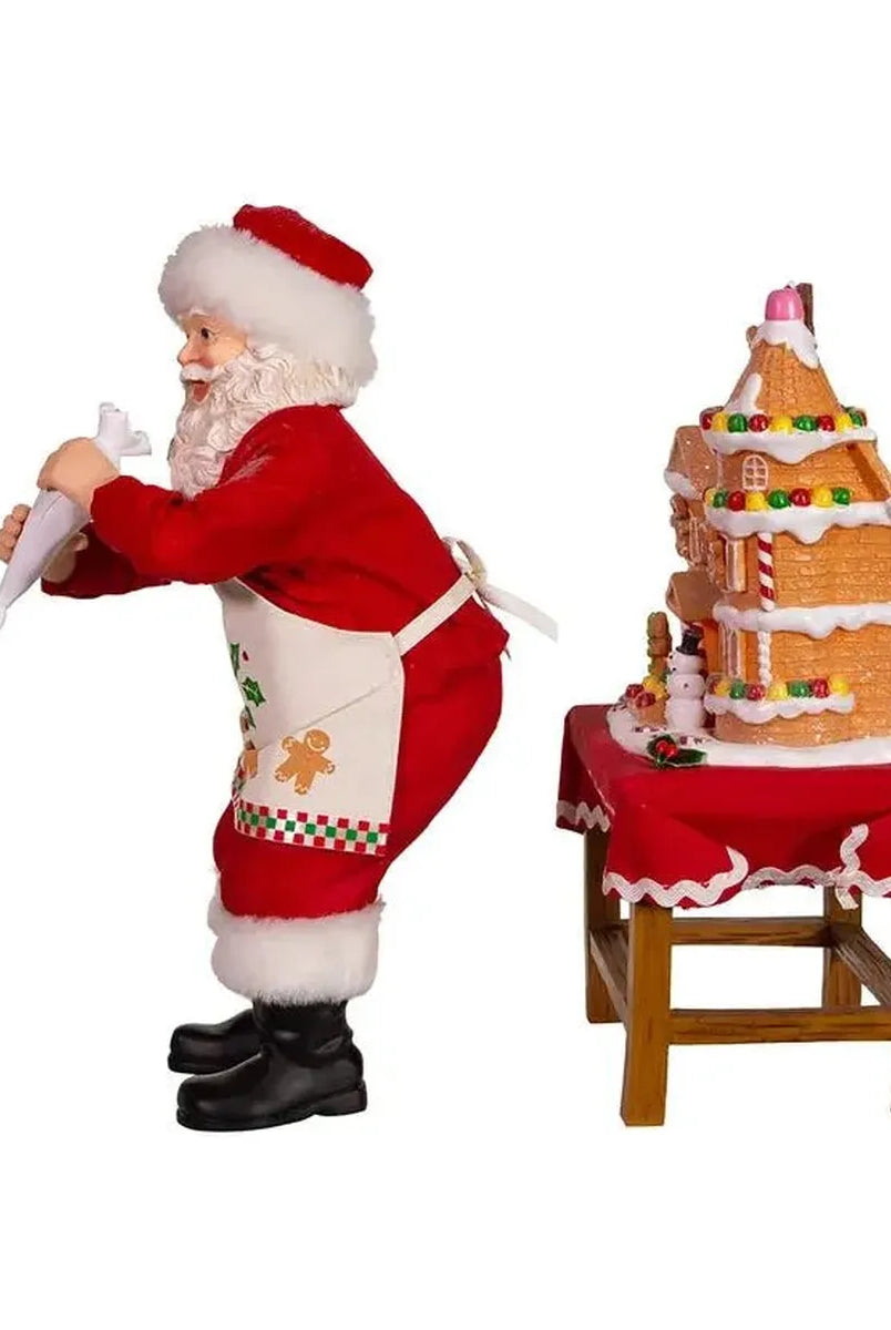 Shop For Kurt Adler 10.5" Fabriche Santa Decorating LED Gingerbread House Table Piece at Michelle's aDOORable Creations