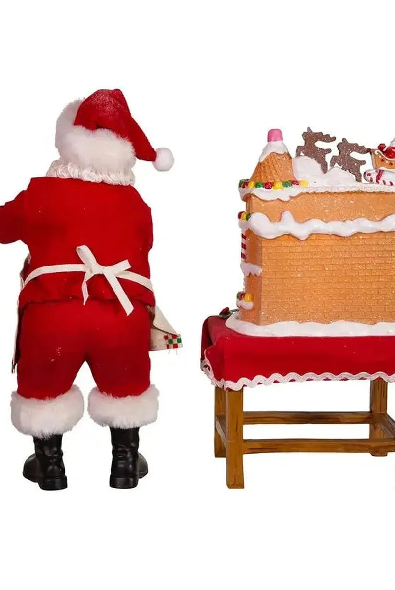 Shop For Kurt Adler 10.5" Fabriche Santa Decorating LED Gingerbread House Table Piece at Michelle's aDOORable Creations
