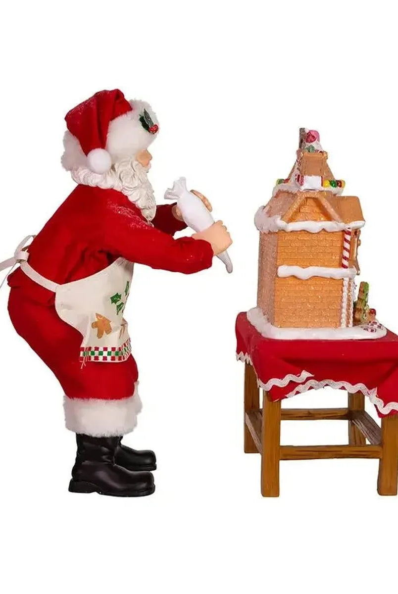 Shop For Kurt Adler 10.5" Fabriche Santa Decorating LED Gingerbread House Table Piece at Michelle's aDOORable Creations