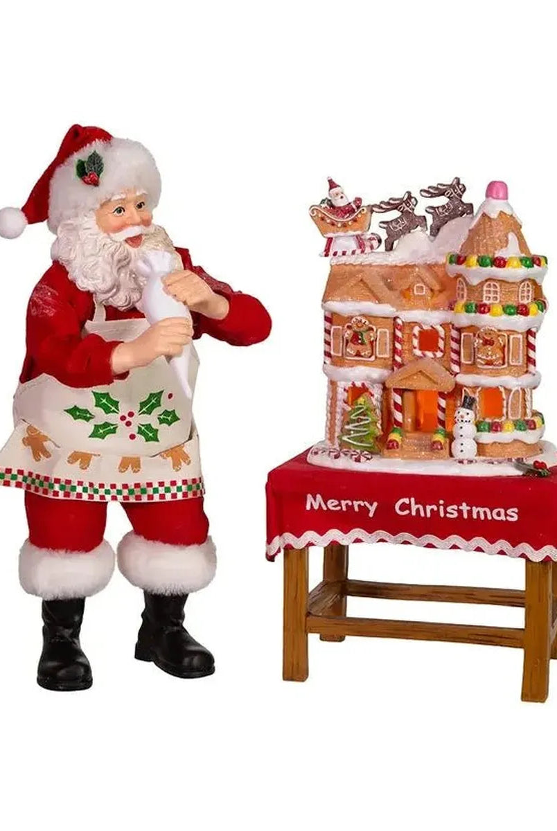 Shop For Kurt Adler 10.5" Fabriche Santa Decorating LED Gingerbread House Table Piece at Michelle's aDOORable Creations