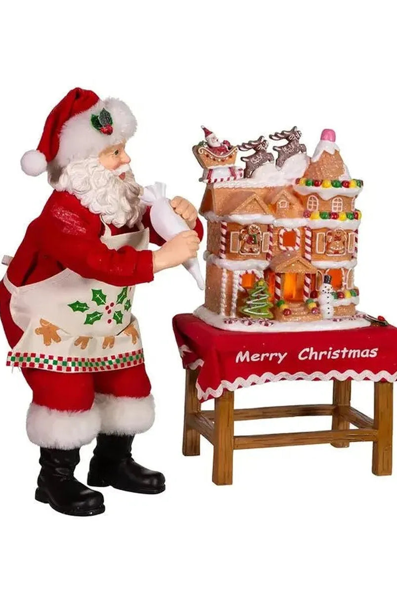Shop For Kurt Adler 10.5" Fabriche Santa Decorating LED Gingerbread House Table Piece at Michelle's aDOORable Creations