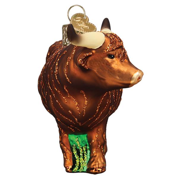 Brown glass Highland cow Christmas ornament with glittery fur texture, curved horns, and a gold hanging loop.