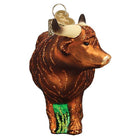 Brown glass Highland cow Christmas ornament with glittery fur texture, curved horns, and a gold hanging loop.