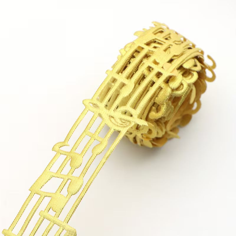 Close-up of gold non-wired music note lace ribbon texture