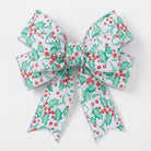 Close up of white holly berry wired edge ribbon bow detail