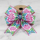 Pink and blue Merry Christmas wired edge ribbon bow with polka dot ornaments