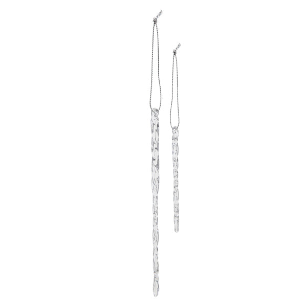 Two clear, twisted glass icicle ornaments with silver hanging strings against a white background.