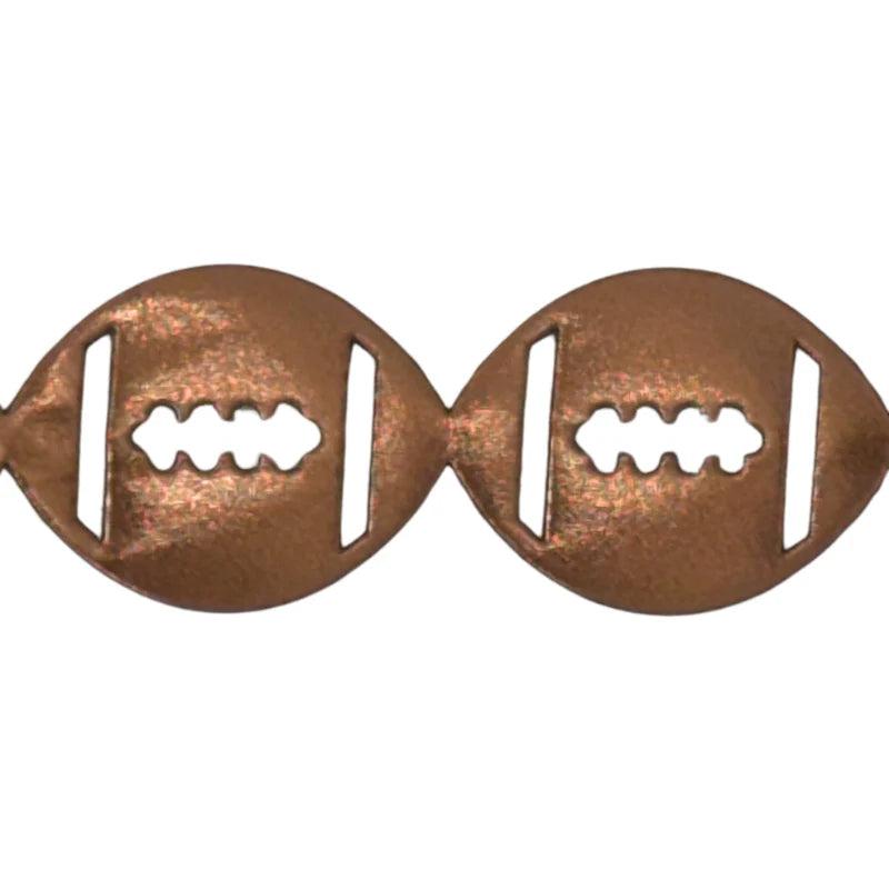 Close-up of copper metallic vinyl football streamer texture