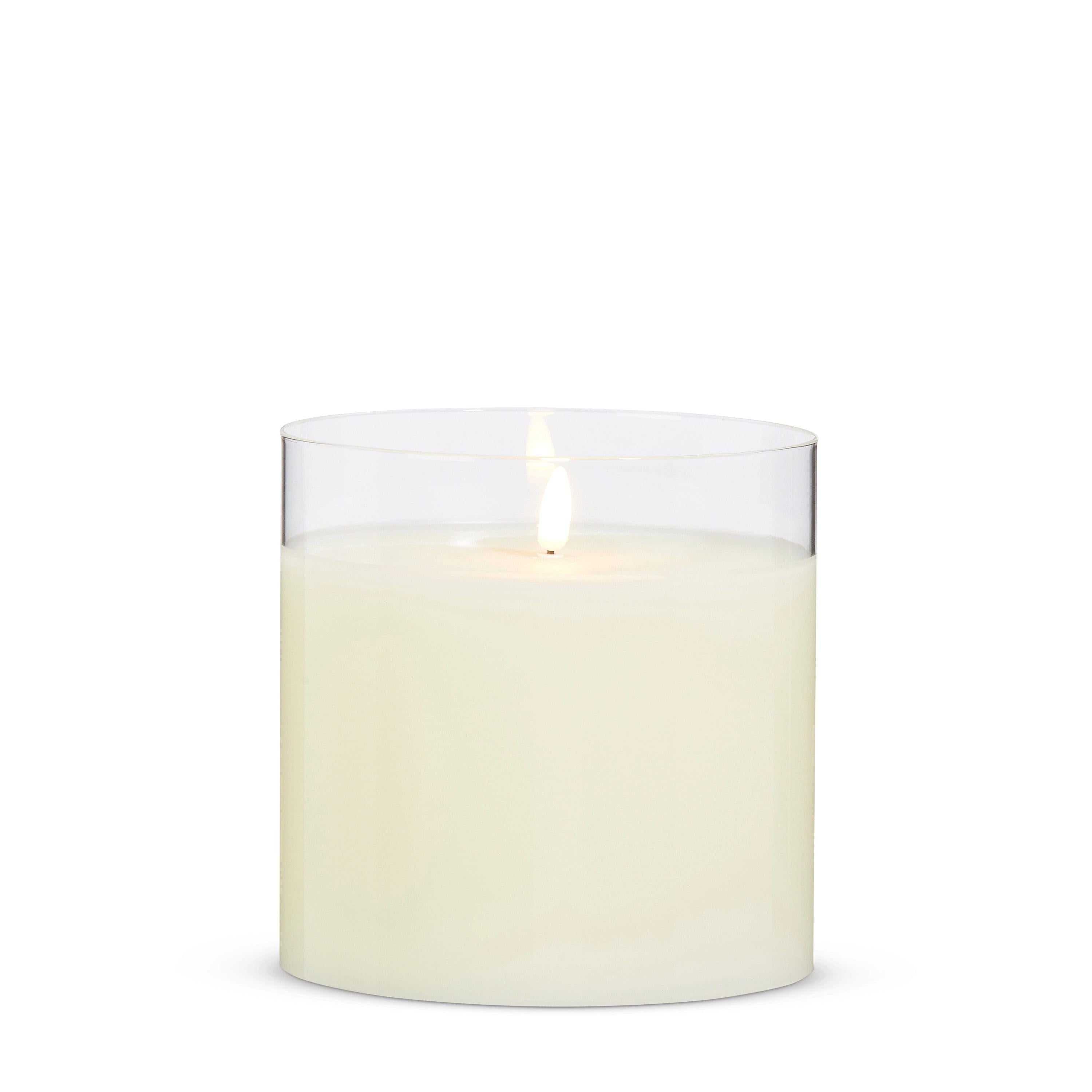 6-inch ivory LED pillar candle with a realistic flickering flame inside a clear glass holder.